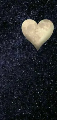 This phone live wallpaper features a heart-shaped balloon floating through a starry night sky