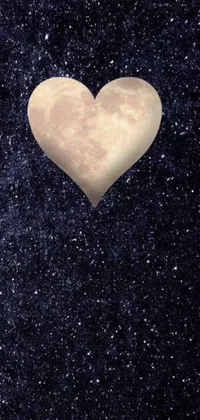 This live wallpaper displays a heart-shaped object against a night sky background with Instagram filters adding a fun twist