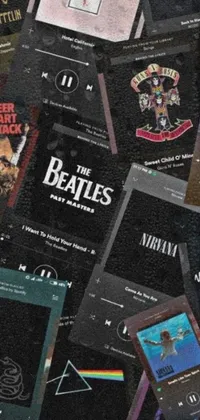 This live wallpaper showcases a pile of music cassettes with an album cover atop them, set on a dark background