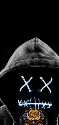 This phone live wallpaper features a dark and edgy close-up image of a person wearing a hoodie