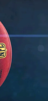 Looking for a phone live wallpaper to show your love for American football? This close-up digital rendering of a football on a green field is perfect