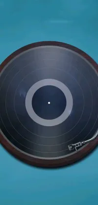 This live wallpaper for your phone features a striking close-up of a record on a spinning turntable
