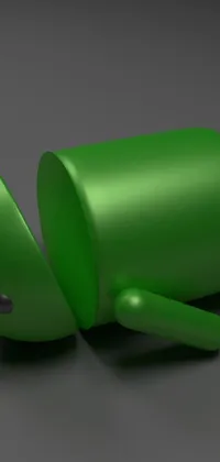 This live wallpaper for phones showcases a 3D rendered green android robot laying on the ground against a dark background