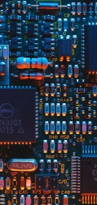 This phone live wallpaper boasts a detailed macro photograph of a computer motherboard