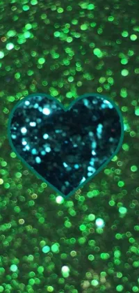 This phone live wallpaper is a stunning macro photograph of a heart on a green background