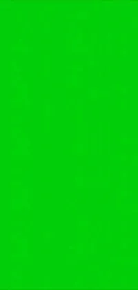This phone live wallpaper features a man standing in front of a bright green screen