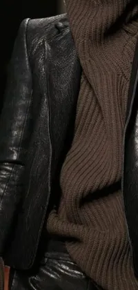 This live wallpaper showcases a hyper-realistic close-up shot of a woman in a trendy brown turtle neck sweater and black leather jacket
