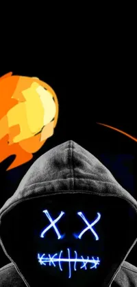 This live phone wallpaper showcases striking digital artwork of a mysterious person in a hoodie holding a fiery ball