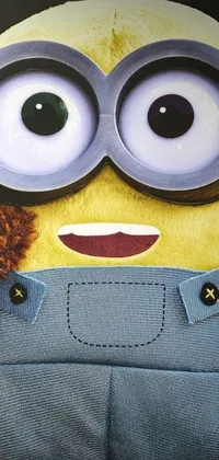 Looking for a cute and playful phone live wallpaper? Look no further than this close-up of a yellow Minion, beloved by fans of the Despicable Me franchise