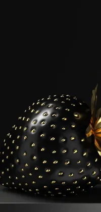 Get a stunning black strawberry live phone wallpaper with a gold and black color scheme