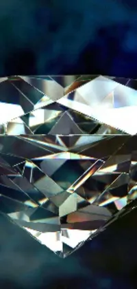 The phone live wallpaper is an awe-inspiring digital art showcasing the sparkling beauty of a diamond set on a vibrant blue background