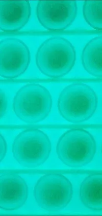 This live wallpaper features a mesmerizing close-up of an ice tray filled with tiny circles