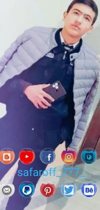This live wallpaper features a man holding a cell phone, looking at a picture, standing in front of a mirror
