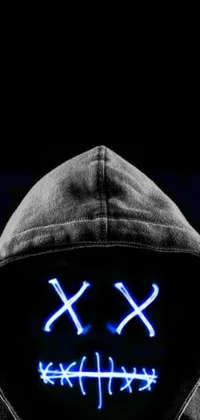 This phone live wallpaper features a close-up of a person wearing a hoodie with eye-catching neon cross on top by a rhox creature in the background