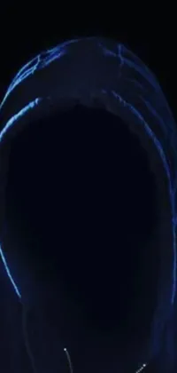 This intriguing live wallpaper features a captivating close-up of a person wearing a hoodie, with only a small portion of their face visible in the shadow