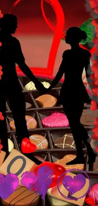 This phone live wallpaper showcases a romantic couple holding hands and a heart-shaped box of chocolates