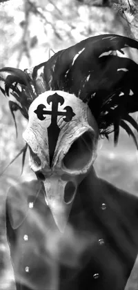 This live wallpaper showcases a unique, black and white photo of a masked figure in the woods