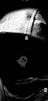 Looking for a captivating live phone wallpaper? Check out this black and white image of a hooded figure with their face hidden in darkness