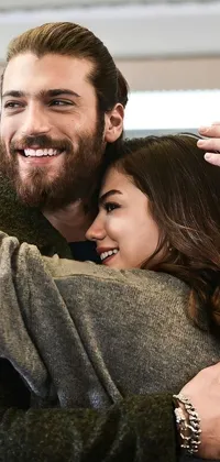 Bring a romantic vibe to your phone with this live wallpaper featuring a man and a woman hugging each other