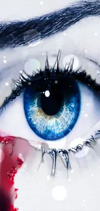 This live phone wallpaper features a captivating close-up image of an eye that is dripping with blood