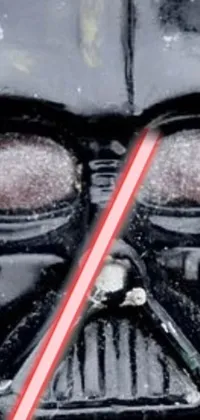 This phone live wallpaper showcases the close-up of a Darth Vader mask rendered in a neo-Dadaist album cover style