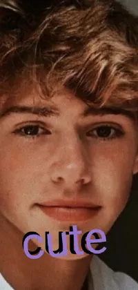 This phone live wallpaper features a close-up of a person wearing a white shirt with short curly brown hair