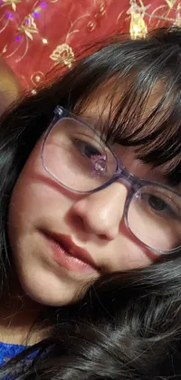 This phone live wallpaper features a close-up image of a person wearing glasses