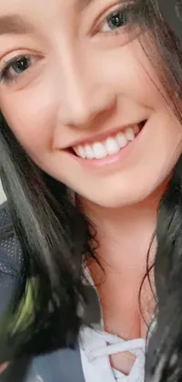 This phone live wallpaper features a gorgeous woman with long black hair and a beaming smile