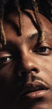 This phone live wallpaper showcases a visually stunning close-up portrait of a person with intricate dreadlocks
