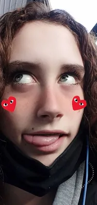 This phone live wallpaper features a close-up shot of a person with unique heart-shaped pupils