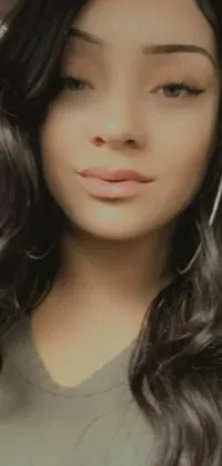 This phone live wallpaper showcases a breathtaking close-up of a young woman with luscious black hair and a stunning profile