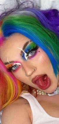 Looking for a bold and edgy phone live wallpaper? Look no further than this close-up shot featuring a person with colorful hair and accurate clown makeup