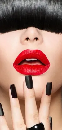 This phone live wallpaper features an alluring woman with striking black nails and captivating red lipstick