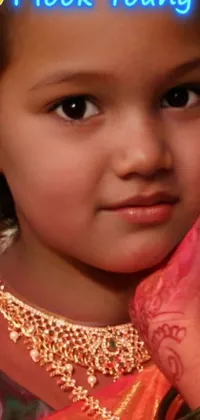 This Android live wallpaper captures an adorable child's face glistening with a happy smile