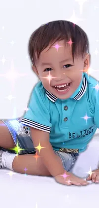This live phone wallpaper showcases a cheerful young boy wearing a stylish polo shirt, photographed in a bright and professional studio