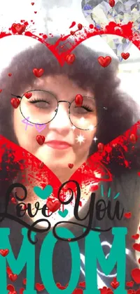 This phone live wallpaper features a woman wearing glasses, surrounded by a heart-shaped frame that has a Polaroid-style look