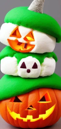 This phone live wallpaper showcases a delightful stack of stuffed pumpkins, with marshmallow-like texture and intricate details