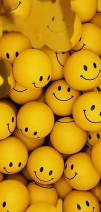Brighten up your phone screen with this beautiful live wallpaper featuring a pile of yellow smiley faces