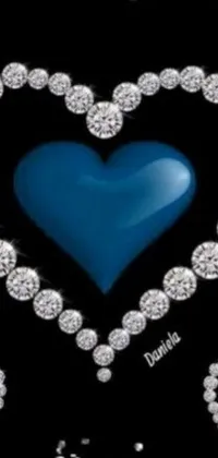 This stunning phone live wallpaper features a mesmerizing blue heart surrounded by diamonds on a black background