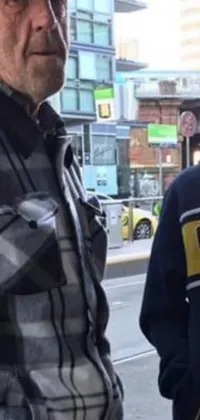 This phone live wallpaper showcases a realistic urban setting featuring two men in yellow hoodies standing on North Melbourne street