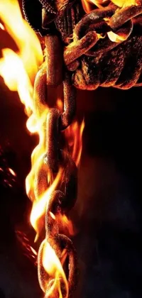 This live wallpaper features a close-up of a fiery chain, complete with flames shooting out, adding a dramatic and dynamic effect