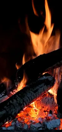 Looking for a cozy and calming live wallpaper for your phone? Look no further than this close-up Fireplace wallpaper, sourced from Pexels and featuring a stunning display of crackling flames that dance and flicker in a mesmerizing fashion