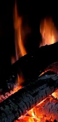 Bring the warmth and comfort of a roaring fire to your phone with this captivating live wallpaper