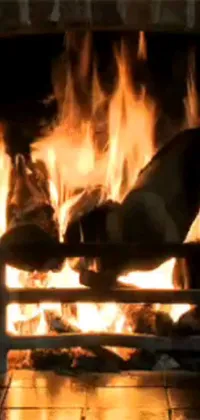 This phone live wallpaper showcases a close-up of a cozy fireplace with a realistic and super lifelike effect