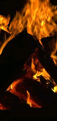 Immerse yourself in the mesmerizing scene of a fiery blaze with this live wallpaper for your phone