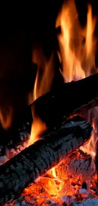 This vivid live wallpaper for your phone features a mesmerizing close-up of a crackling fireplace, complete with wooden logs and detailed, lifelike flames
