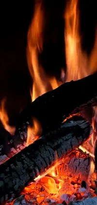 Bring the warmth of a cozy fire into your phone with this live wallpaper