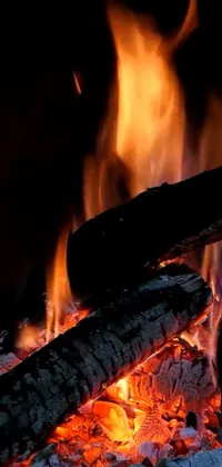 This live wallpaper brings the warmth and comfort of a cozy fireplace to your phone