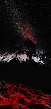 This live phone wallpaper captures the beauty of the night sky with a gorgeous mountain backdrop