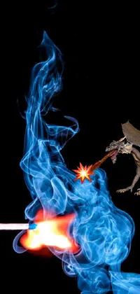 This phone live wallpaper features a close-up view of a fiery, crackling fire with smoke billowing out, as well as an image of a blue fireball against a black backdrop